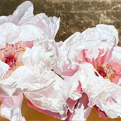 Tree peonies in bright sunshine on gold leaf